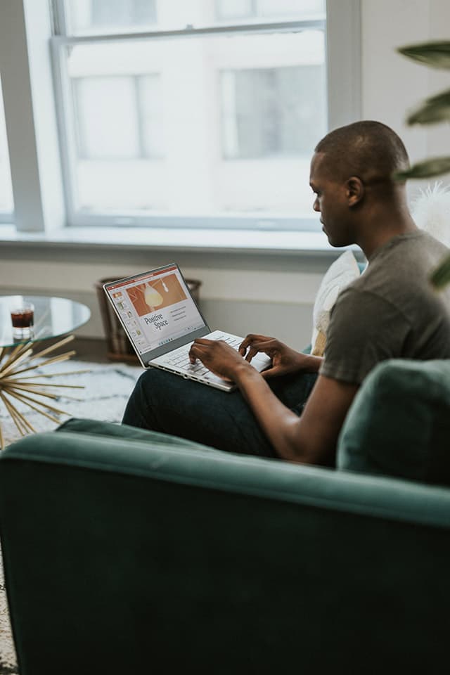 man-laptop-sofa